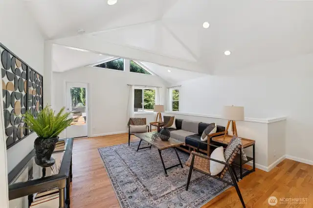 Vaulted ceilings in the family roomn continue to flood the home with natural light.