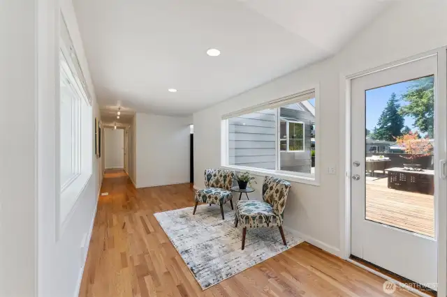 Breezeway leading from guest bedrooms/kitchen, connect the family room.  Access to the backyard deck as well.