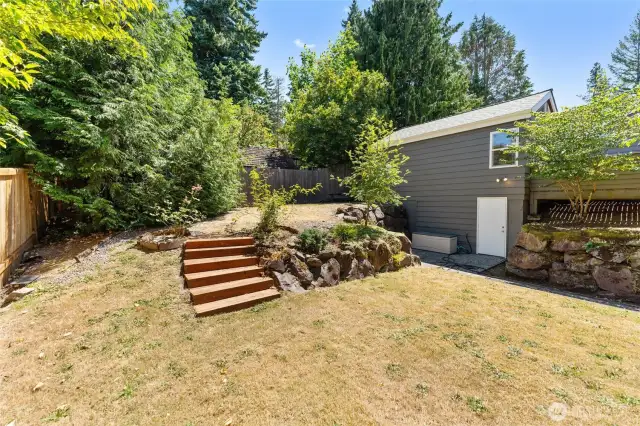 Another view of backyard. The white door provides access from the basement.