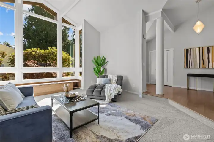 Living room is just off of the entryway, which includes a coat closet and beautiful chandelier.