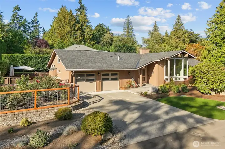 Your "lawn" will be evergreen and easy to maintain since it is gorgeous newer turf (2023). A show-stopper rose garden is a delight for your eyes and nose.