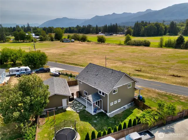 Backyard is fully fenced and level, perfect for pets or entertaining.