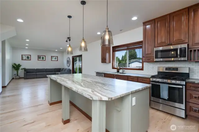 Stainless appliances and tile backsplash. Kitchen faucet has cold water filtration system as well.