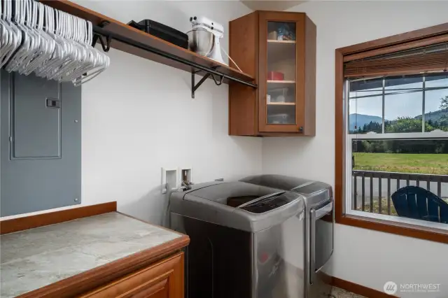 Main floor laundry, washer and dryer stay. More storage and hanging options make laundry a breeze!