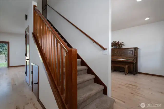 Stairs upon entry, closet and storage beneath.
