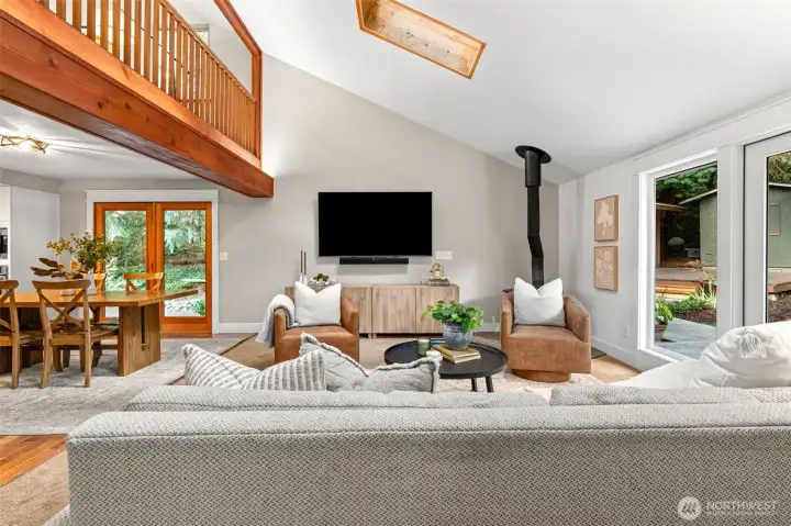 The vaulted ceilings connect the lower living room with the loft above. The warm tone of the wood is stunning and needs to be seen in person!