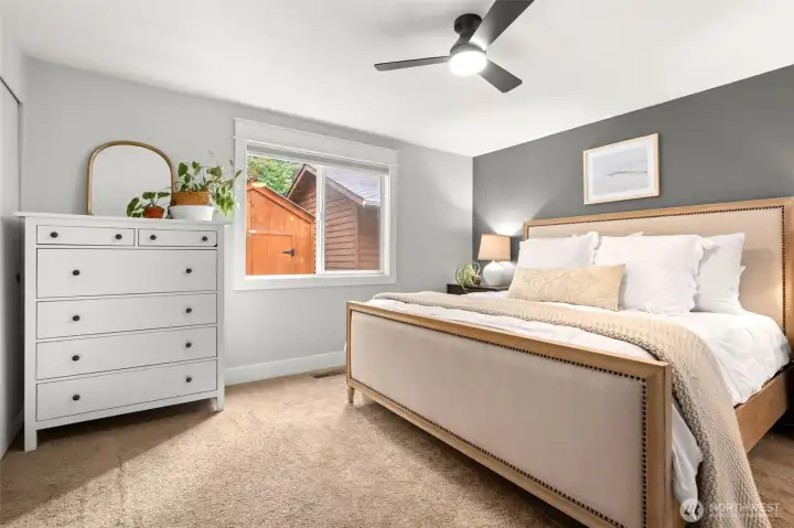 The main floor primary bedroom has room for a King bed and large night stands. You will love that there are 3 closets in this room!