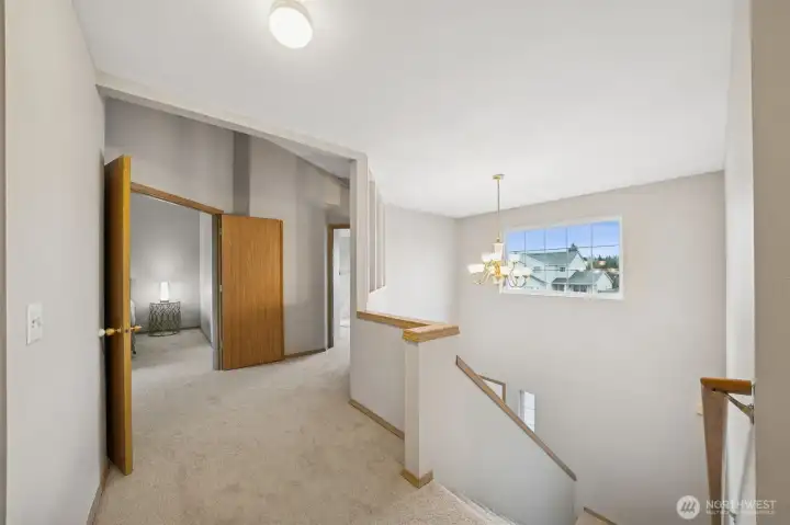 extra wide upstairs hallway and wide staircase