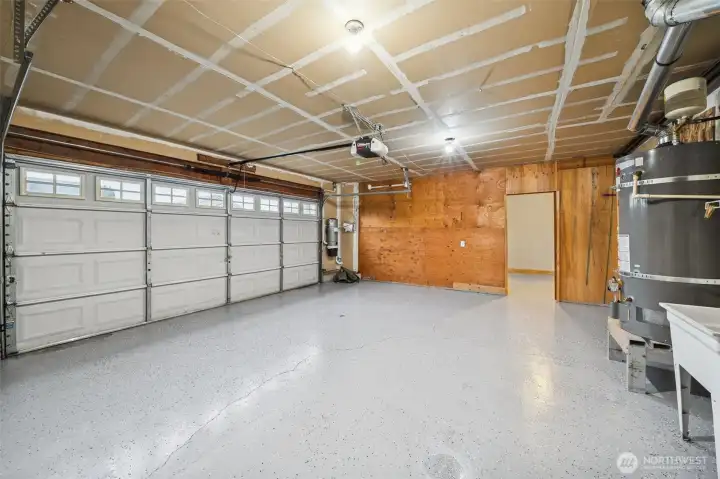 Finished garage, new water heater, vacuum system and pull-down attic storage