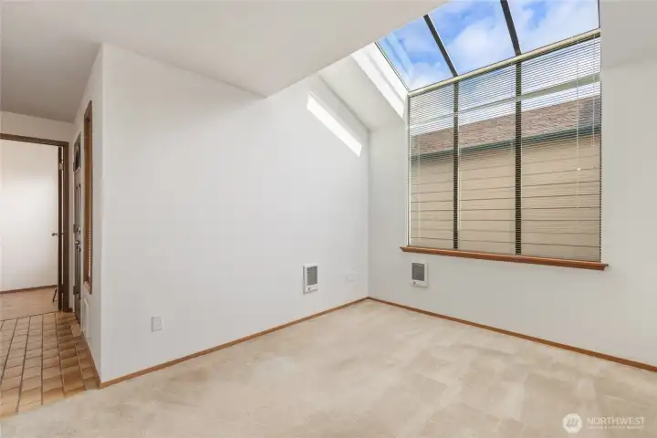 Room could be used Tons of natural light fills this room.