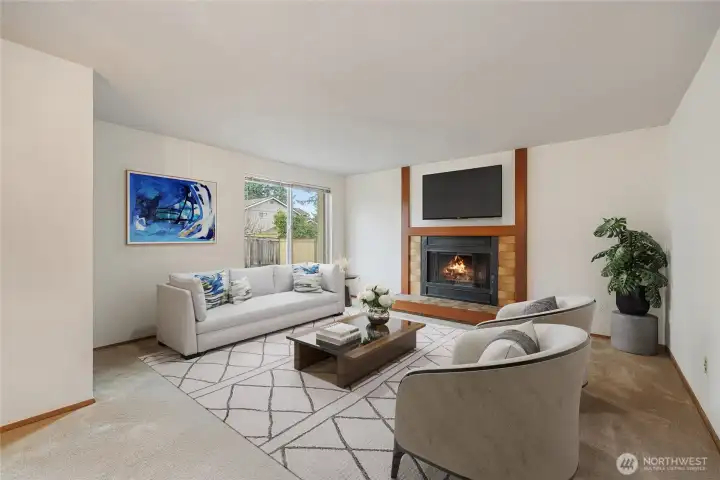 You'll love this cozy fireplace in this virtually staged living room