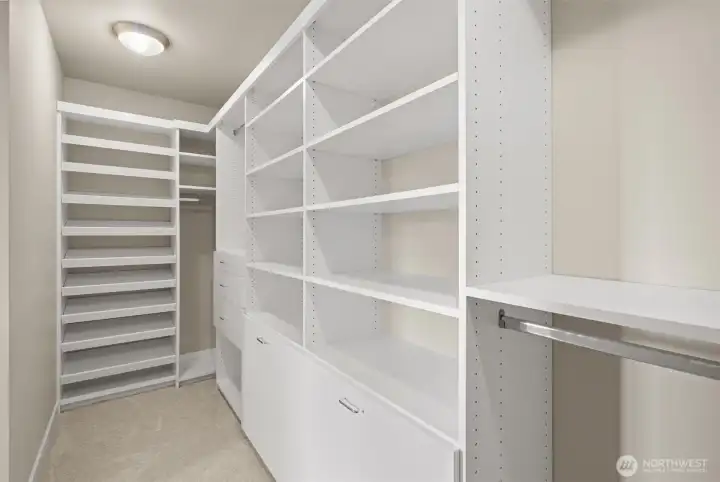 Primary walk-in closet with built-ins.