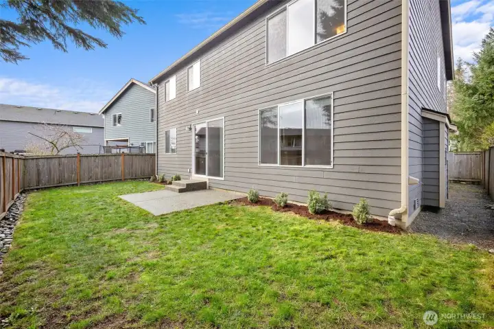 Flat yard with patio.