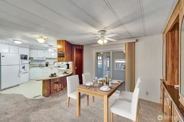 Formal dining room has space for 6-8 table seating. Built in hutch is handy for collectibles, used as bar station or for additional entertainment necessities. Wine closet at the endi foi the breakfast bar. Virtually staged.