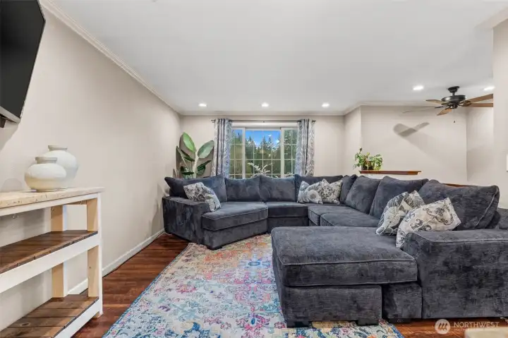 Illuminating this open-concept space, this expansive living room centralizes itself as the heart of the home.