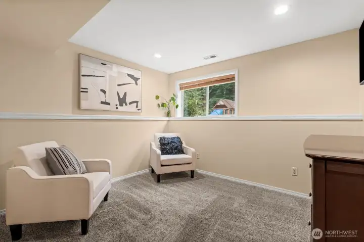 Staged as a extra bonus room, this flex space is adaptable for a home office or extra living room.