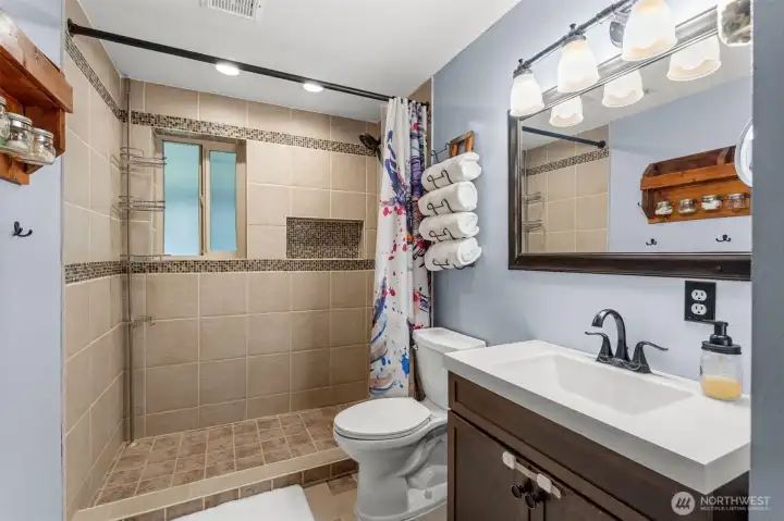 Gorgeous shared bathroom located on the lower floor.