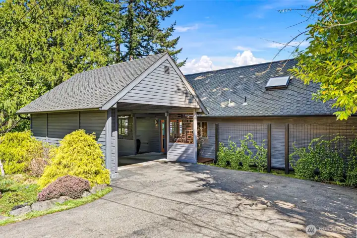 Attached one car carport with ample utility and attic storage