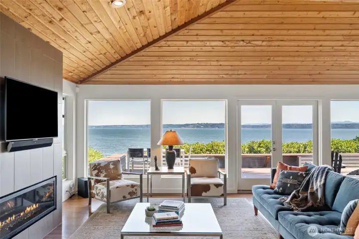 A wall of windows offers sweeping water views
