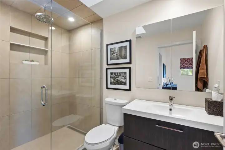 Primary bathroom with glass-enclosed shower