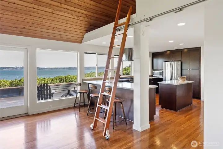 Library ladder provides access to lofted second bedroom