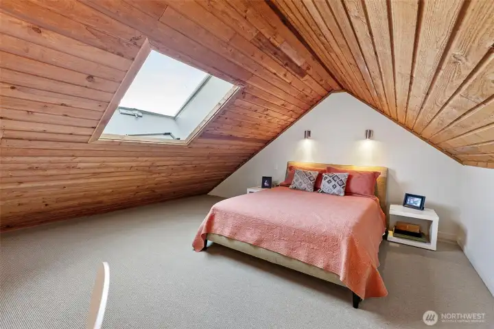 Skylight provides lofted bedroom with ventilation and plenty of natural light