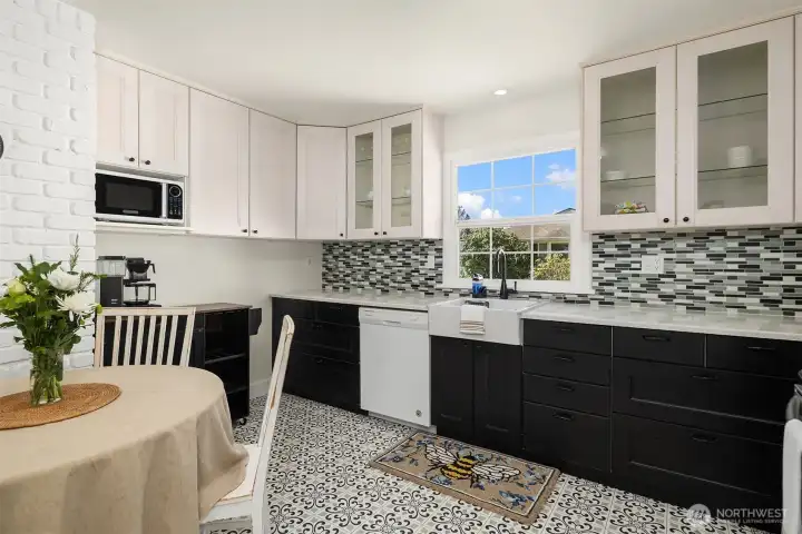 Remodeled kitchen with eating area. New cabinets w/ quartz counters and new flooring.
