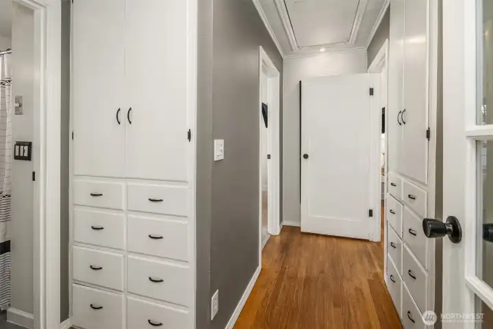 Hallway to bedrooms with lots of built in storage