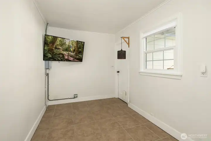 Flex room between kitchen and garage. What would you use this for? Home office? Craft room?