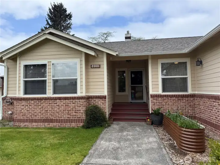 Cement plank sliding and brick facade, roof and windows...updated less than 5 years ago.