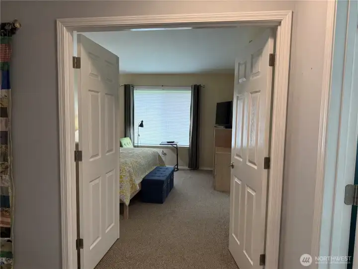 Primary suite with double doors for a grand entrance. Matching carpet in all the bedroomss.