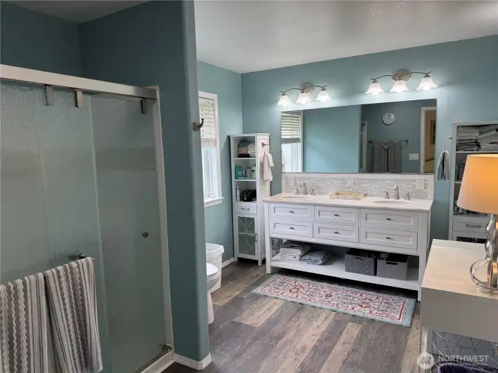 Large Primary bath with large shower and elegant double sink cabinentry.