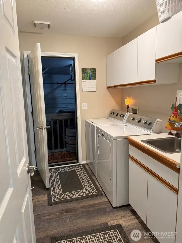 Laundry/mudroom leads to the two car garage.