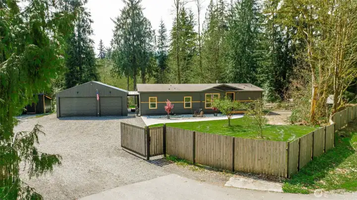 Gated equestrian estate in Arlington, WA featuring an electric gated entry, 4.48 private acres, and stunning Pacific Northwest surroundings. Ideal for buyers searching for private rural property with acreage near Arlington Washington.