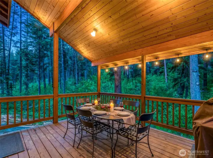 Warm wood finishes and ambient lighting enhance the inviting atmosphere, ideal for morning coffee, evening gatherings, or simply enjoying the serenity of nature.