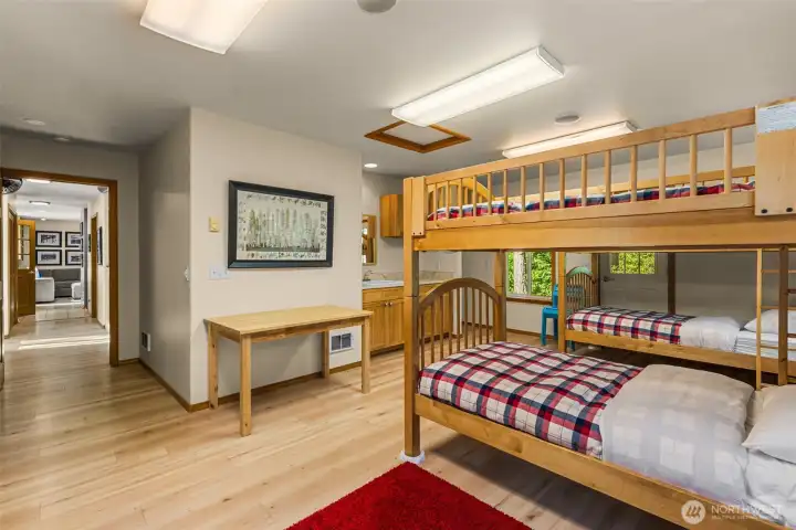 Large windows bring in natural light and forested surroundings, offering a comfortable retreat for guests after a day of mountain adventures.