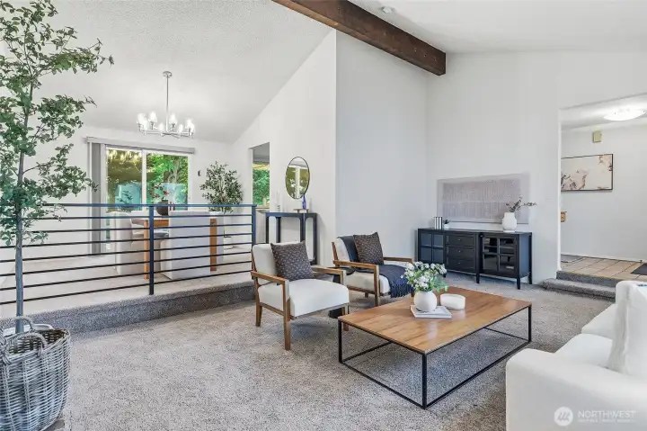 Main level living area with living room and open dining room.