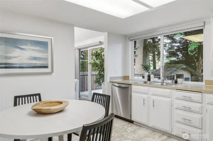 Kitchen overlooks the backyard.
