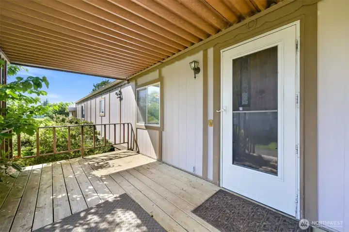 A nice covered porch to enjoy your morning coffee.