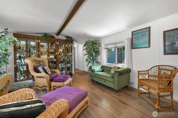 Inside there are beautiful engineered hardwood floors and vaulted ceilings