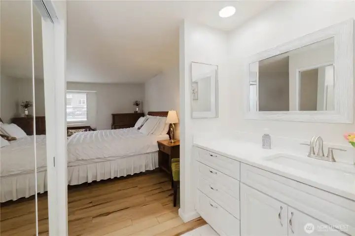 Primary En-Suite Bath looking to Primary Bedroom, Walk In Closet on left & Vanity on right. Primary En-Suite Bath looking to Primary Bedroom, Walk In Closet on left & Vanity on right.