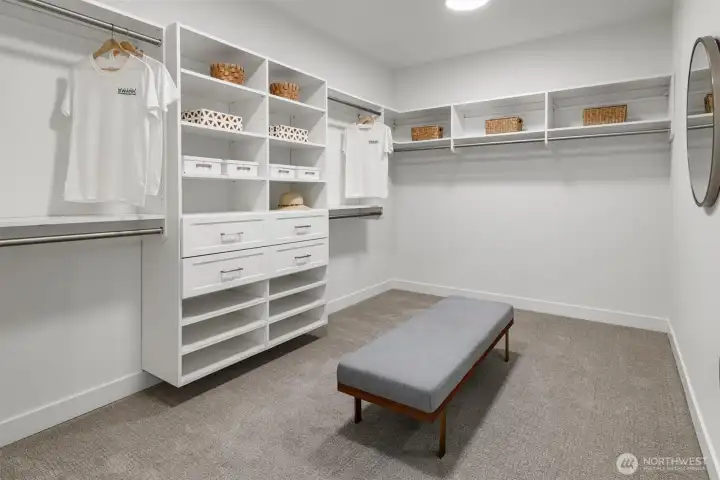 Huge walk in closet off primary suite with built in organizer