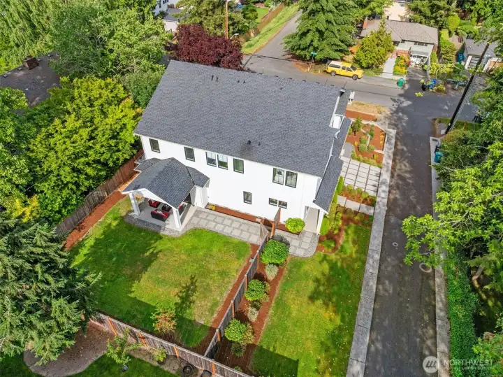 Aerial photo looking east. Large level fenced backyard! Sought after Broadview neighborhood.