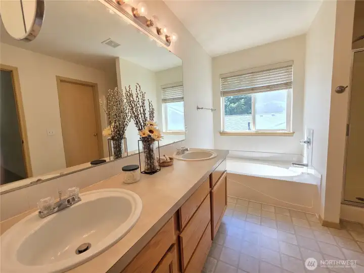 Main bedroom: 5-piece bath with dual sinks.
