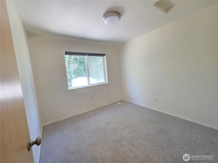 2nd bedroom facing the backyard.