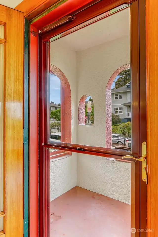 Charming, arched and covered front entrance