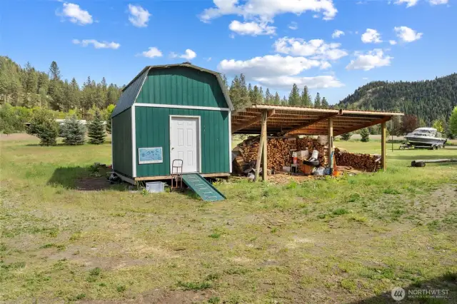 Large storage shed attached to woodshed