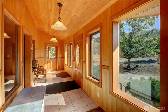 Enclosed Entry with doors out each end to deck