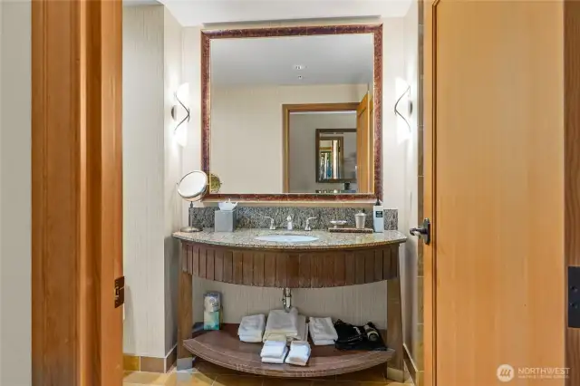 Vanity in bathroom with all the supplies.