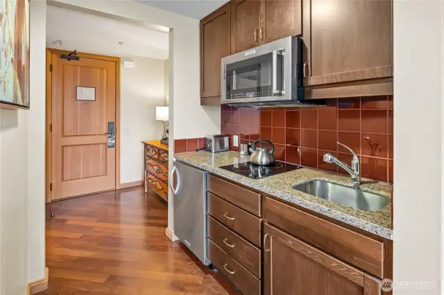 Condo home comes with all the kitchen supplies.